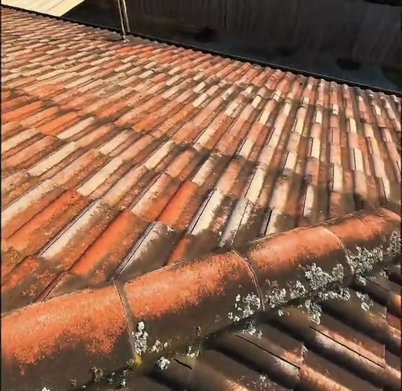 Before: a tiled roof in Clayton: the tiles before, and the house from the street after